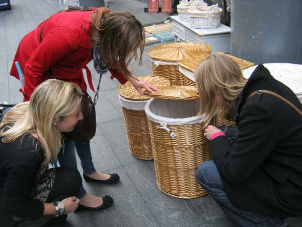 Three women looking for a clue in a basket.